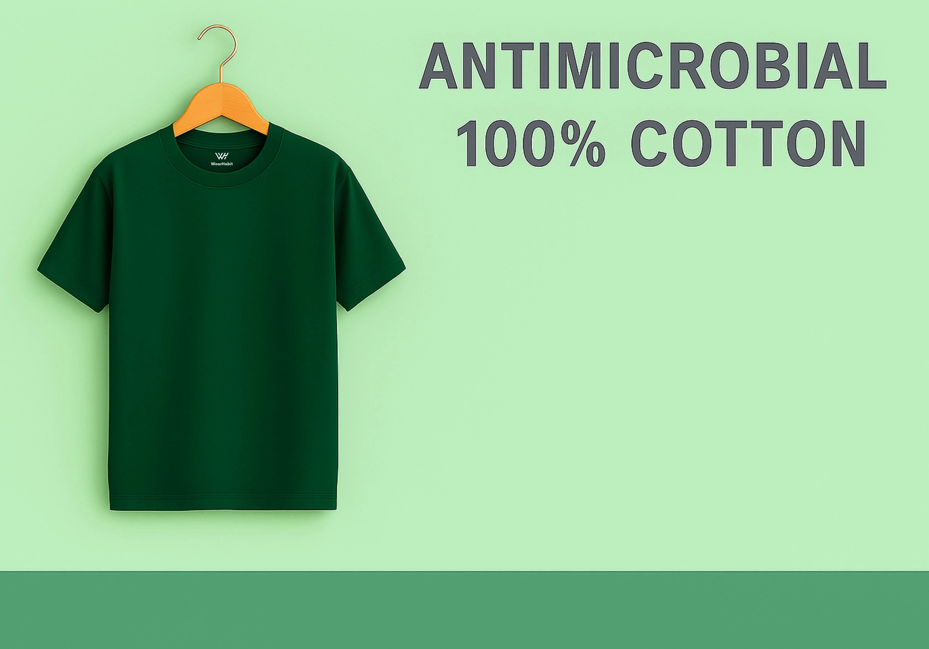 Green t-shirt on a hanger with 'Antimicrobial 100% Cotton' text on a green background