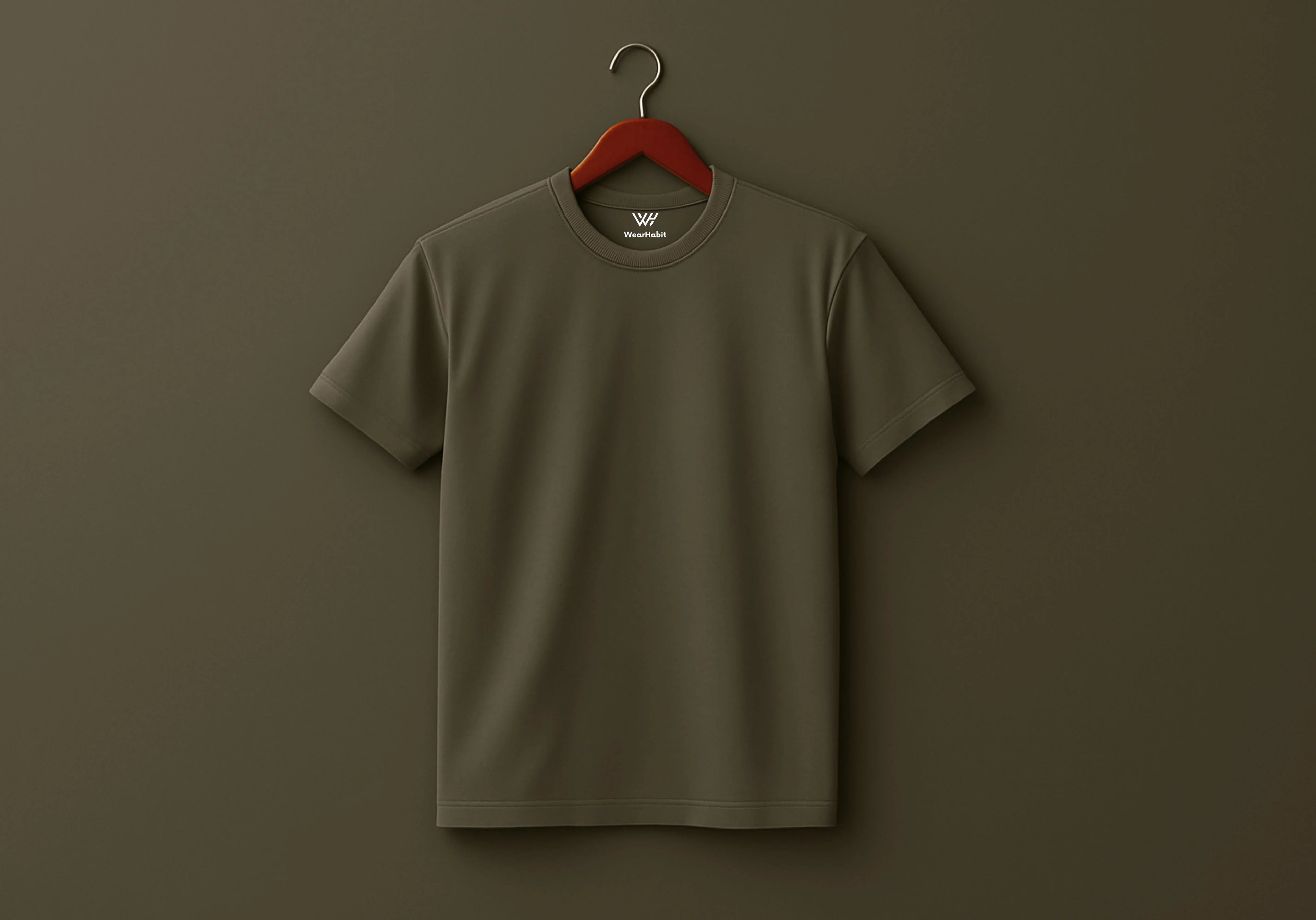 Brown t-shirt on a red hanger against a brown background