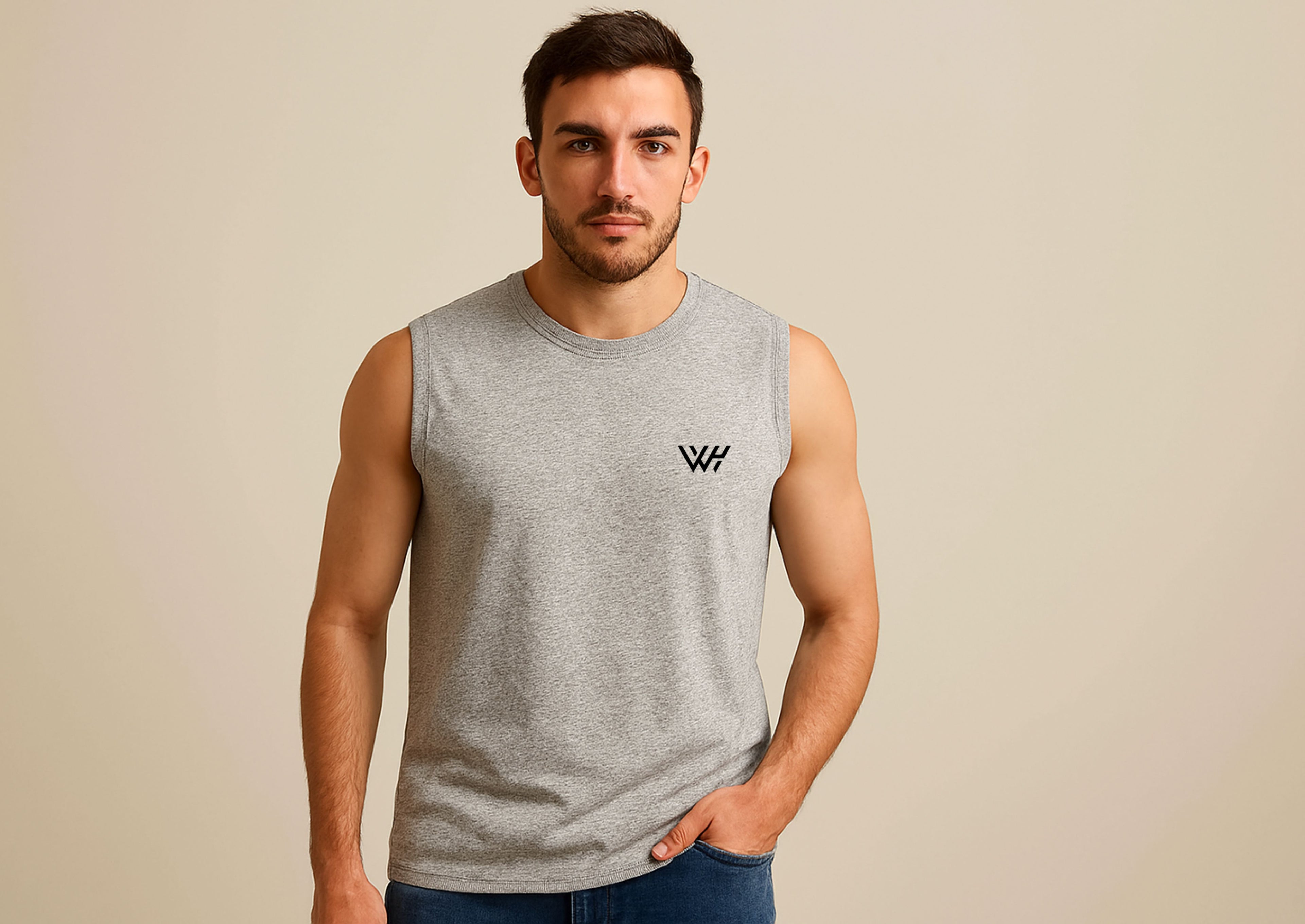 Man wearing a gray sleeveless shirt with a logo on a beige background
