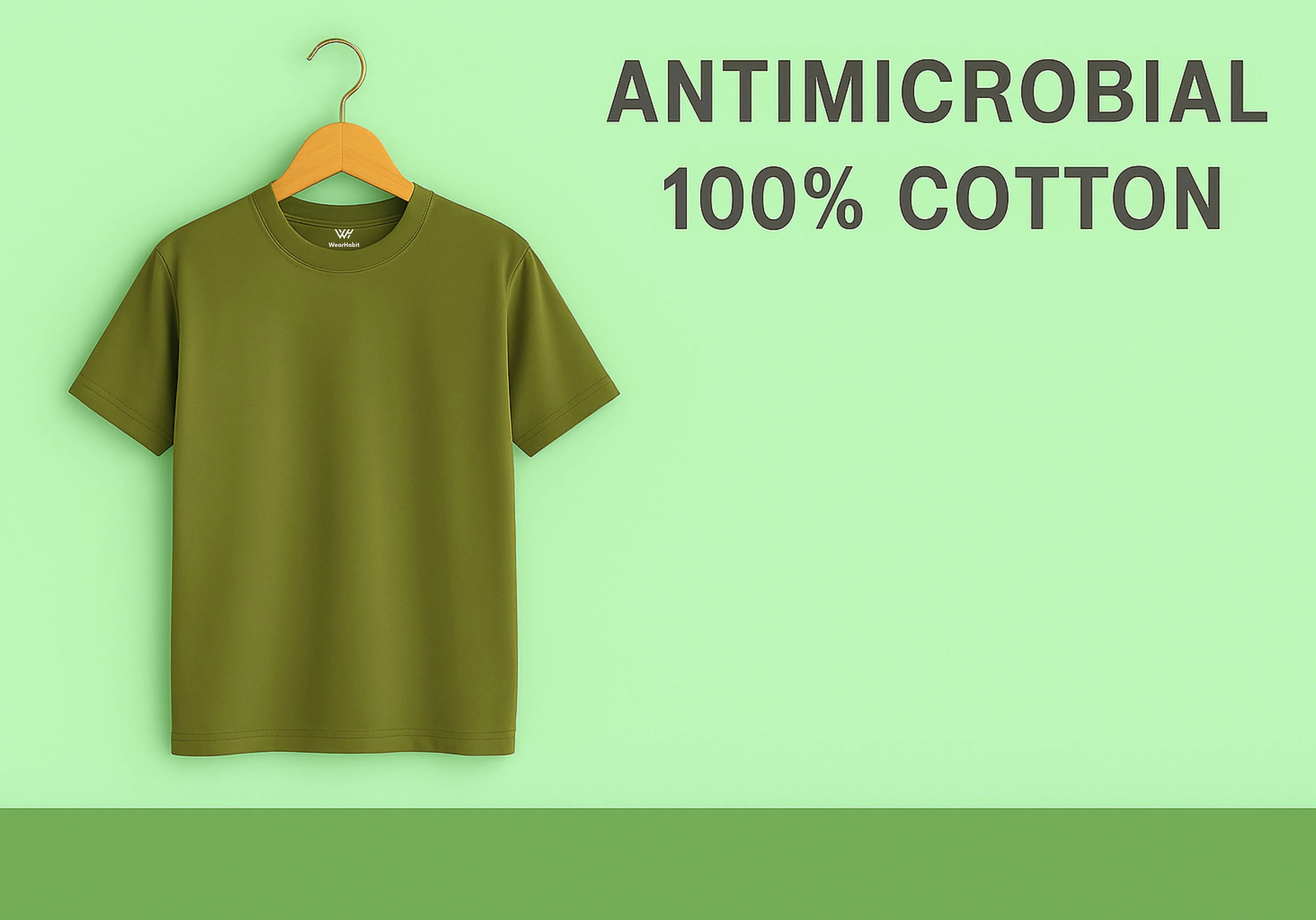 Green t-shirt on a hanger with 'Antimicrobial 100% Cotton' text on a green background