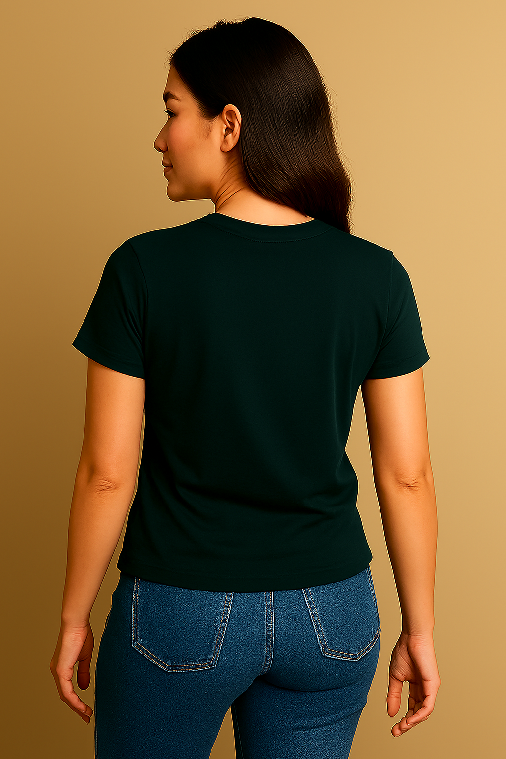 Woman wearing a dark green t-shirt and blue jeans on a beige background