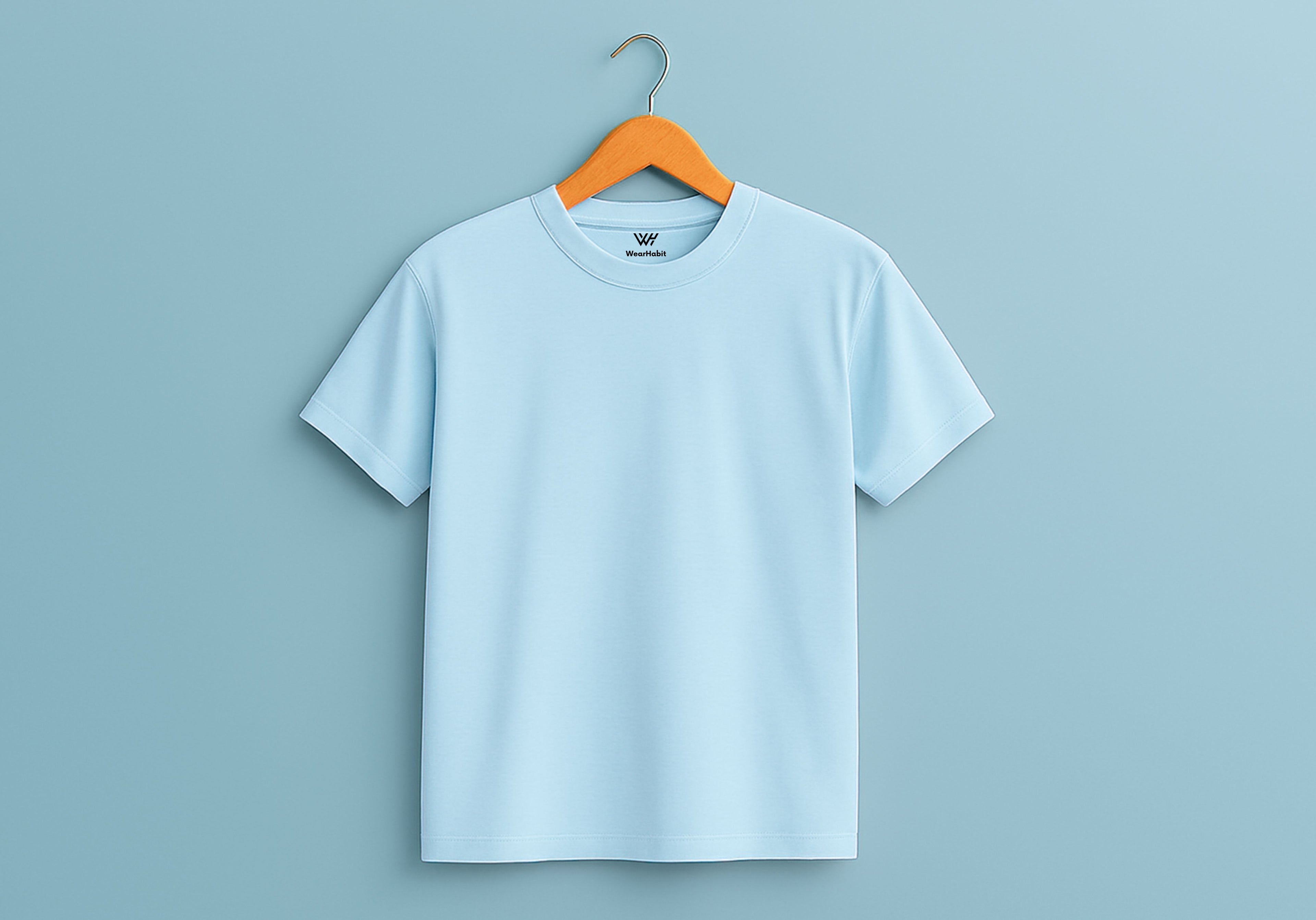 Mint color t-shirt on a hanger against a light blue background